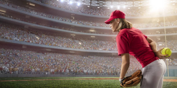 istock Softball female player on a professional arena 886630312