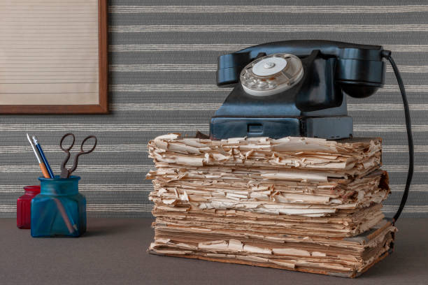 istock Old black phone and office supplies 886630732