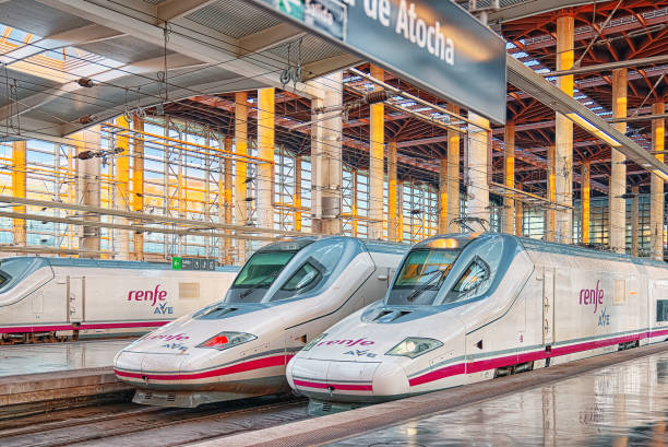 Modern hi-speed passenger train of Spanish railways company-Renfe, on Madrid railways station Puerta de Atocha. stock photo
