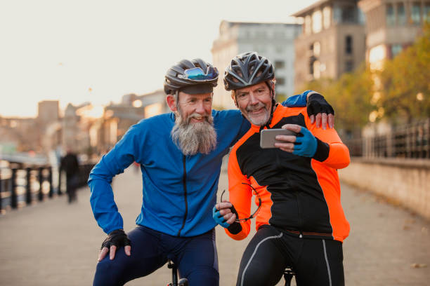 istock Two Senior Men on Racing Bikes taking a Selfie 886635660
