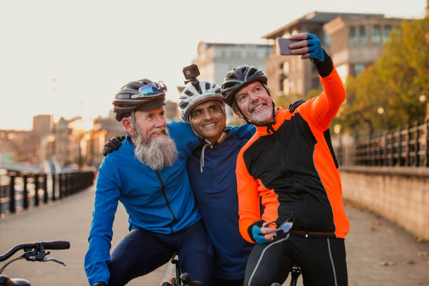 istock Three Senior Men on Racing Bikes taking a Selfie 886635718