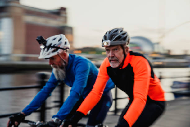 istock Two Senior Men on Racing Bikes 886635810