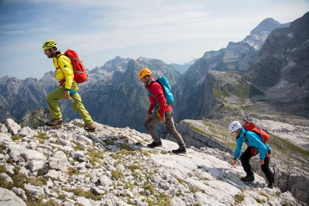 istock Hikers walking on rocky mountain 886636164