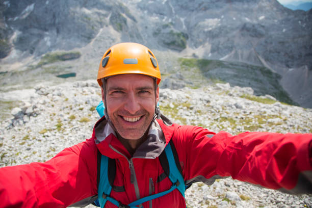 istock Mid adult man taking selfie 886636446