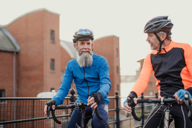 istock Two Senior Men on Racing Bikes 886636564