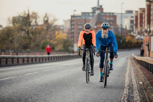 istock Two Senior Men on Racing Bikes 886636576