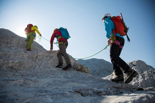 Hikers climbing on a rock mountain