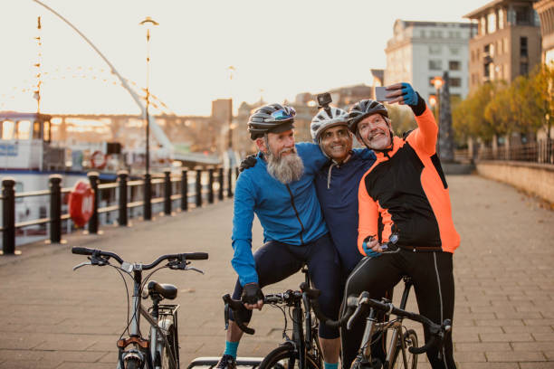Three Senior Men on Racing Bikes taking a Selfie