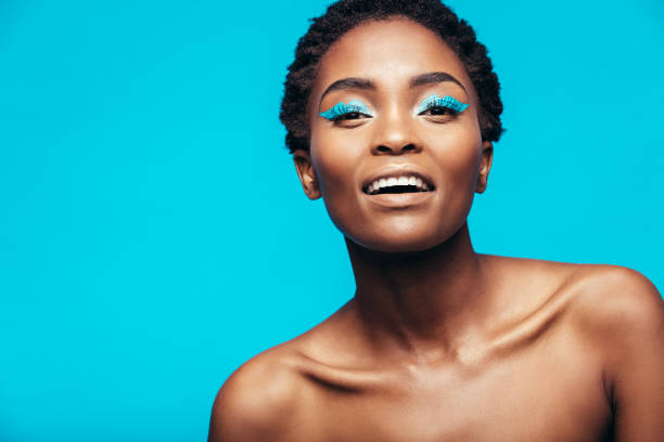 istock African woman with blue eye shadow 886639056