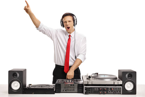 istock Cheerful formally dressed guy playing music on a turntable 886639822
