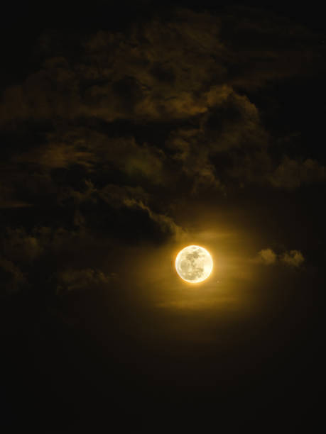 istock silhouette full moon with light and beauty cloudy sky in the dark night background 886640084
