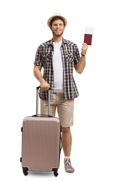 istock Tourist with a suitcase and passport 886640930