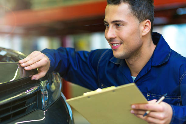 istock Mechanic working on car in auto repair shop 886642646