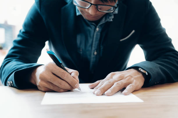 istock Businessman signing contract making a deal. 886643540