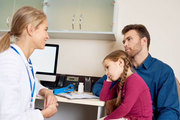 istock Female Pediatrician Working with Patients 886643592