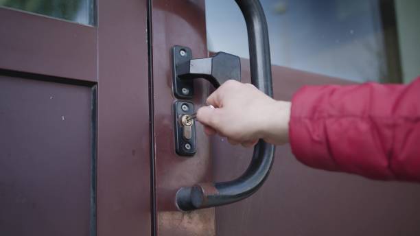 istock Man Unlocking a Door and Coming In 886646578