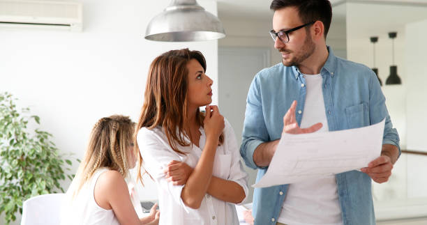 istock Picture of young architects discussing about project 886646886