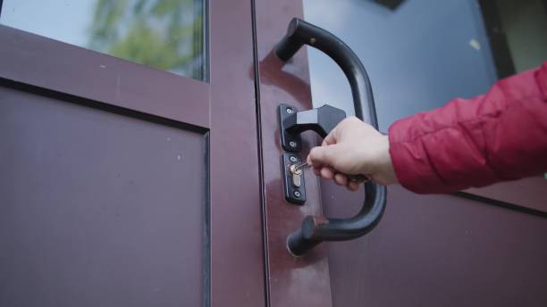 istock Man Unlocking a Door and Coming In 886646896