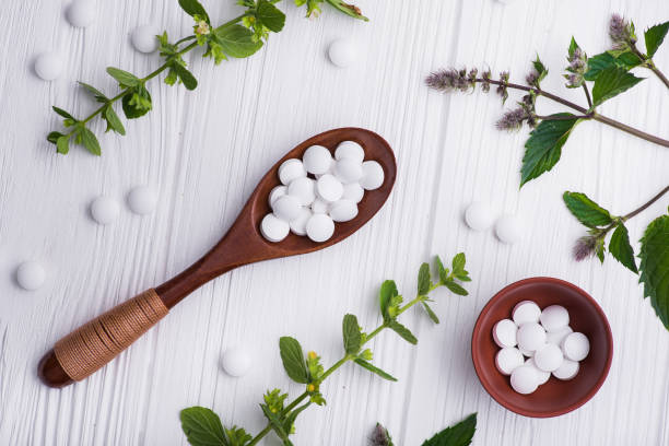 istock Natural organic pills with herbal plant 886650452