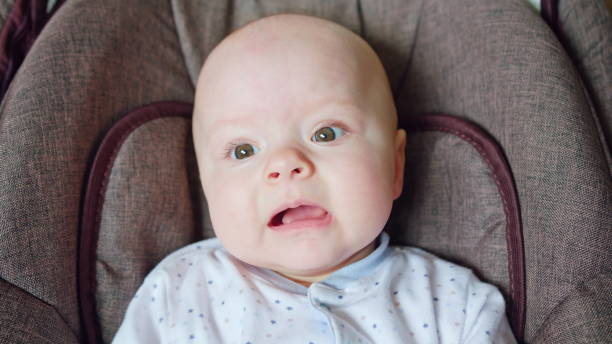 istock Cute Baby Lying in Pram 886650486