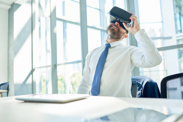istock Mature Businessman Using VR Glasses in Office 886650798