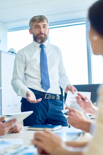 istock Mature Boss Briefing Employees in Meeting 886650800