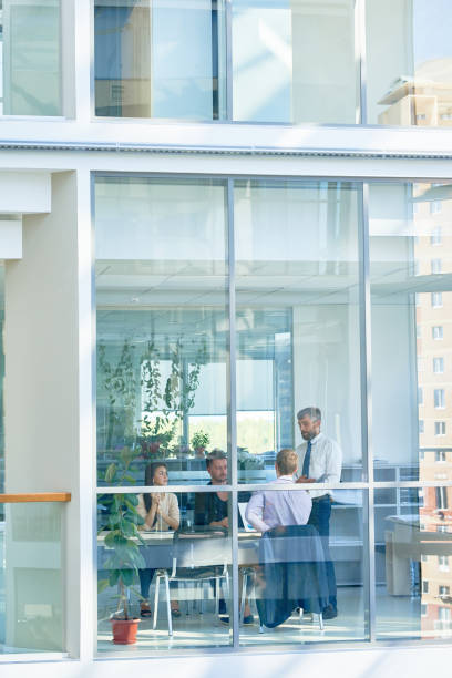 istock Business Meeting in Modern Glass Building 886650820