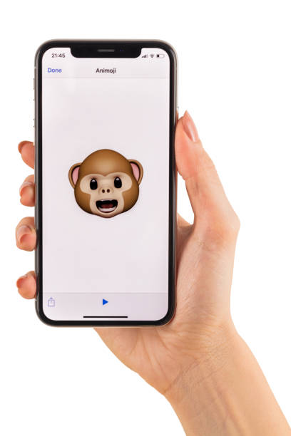 Apple iPhone X Animoji Holding Hand Istanbul, Turkey - December 1, 2017: Happy smiling poop 3d animoji emoji generated by Face ID facial recognition system with different face emotion close-up of the new iphone X 10 Display - tilt-shift lens used eye nebula stock pictures, royalty-free photos & images