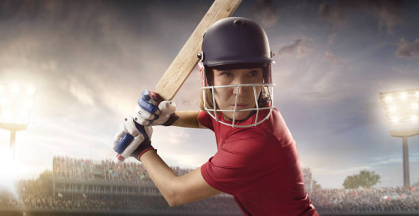 istock Cricket female batsman on a professional arena 886657236