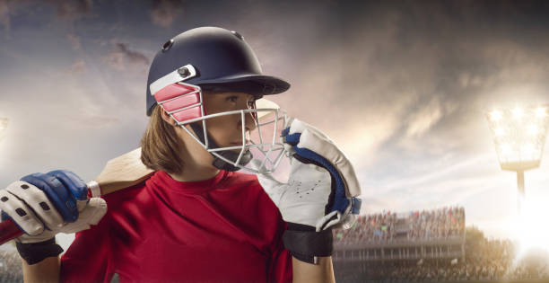 istock Cricket female batsman on a professional arena 886657284