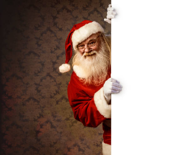istock Santa Claus pointing on blank banner 886657396