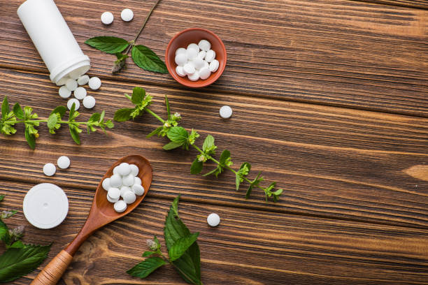istock Natural organic pills with herbal plant 886657408