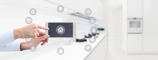 istock home automation hand touch smart phone screen with symbols on kitchen blurred background 886658214