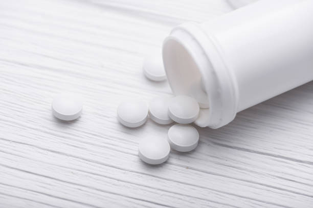 istock Medicine pills on white table 886661350