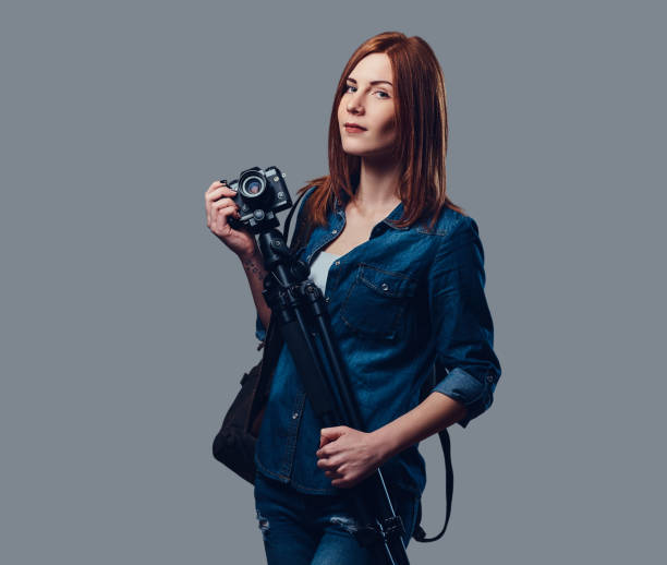 istock A woman holds photo camera. 886661466