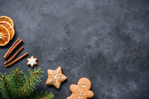 istock Christmas background with fir tree branches, cinnamon and cookies 886661598