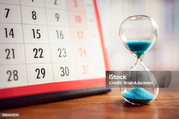 Hourglass And Calendar Stock Photo - Download Image Now - Deadline, Calendar, Hourglass