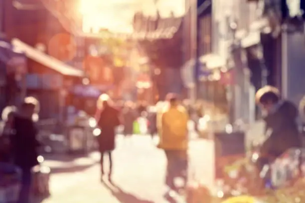 Photo of Crowd of shoppers walking and shopping on a high street