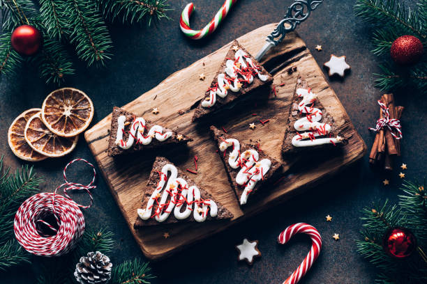 istock Chocolate brownies with candy canes on dark background 886662346