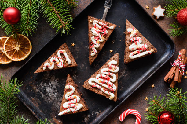 Chocolate brownies on baking sheet for Christmas, table top view