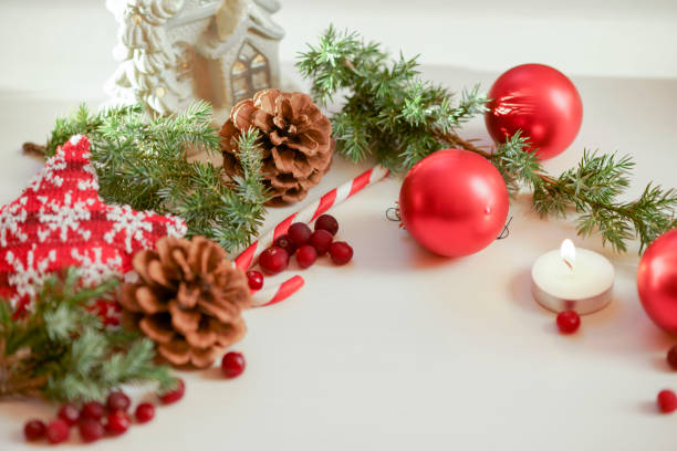 istock 2018 Christmas card with green Christmas tree and a burning candle 886662552