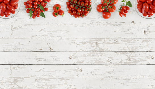 tomatoes top view on kitchen white wooden table copy space template