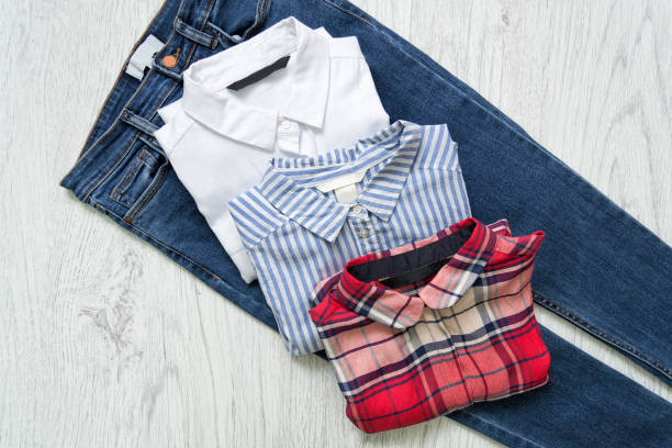 istock Three shirts on jeans, white, checkered, striped. Collage. Fashionable concept. 886664934