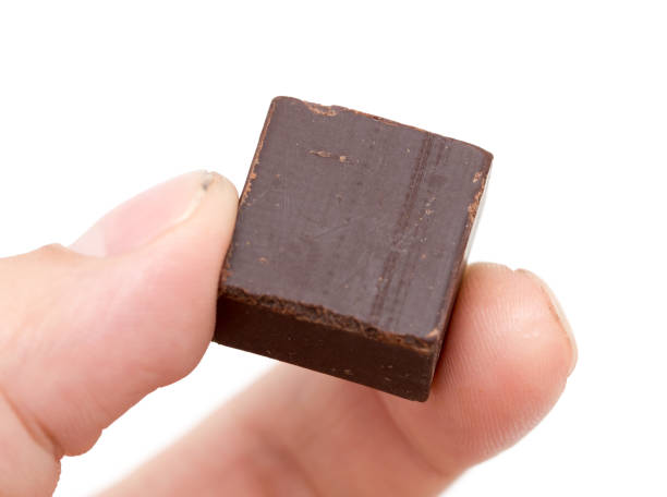 istock chocolate in his hand on a white background 886668752