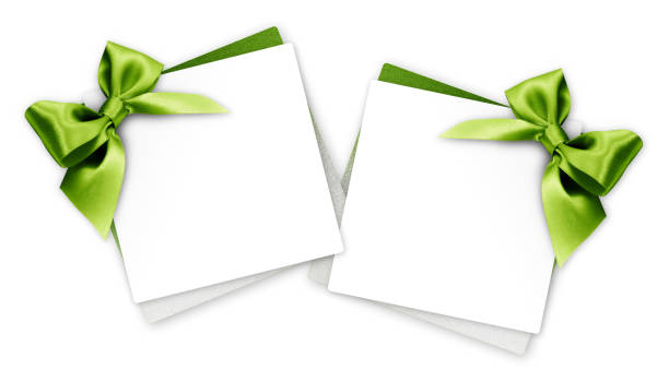 istock gift cards with green ribbon bow Isolated on white background 886672570