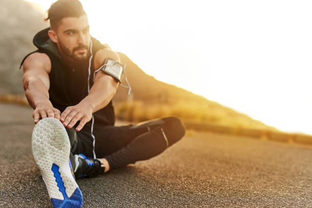istock Loosening his legs before he works out 886673384