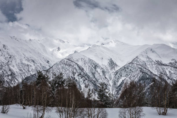 istock Panoramic view on snow winter mountains and cloud sky. Caucasus Mountains. Svaneti region of Georgia. 886675978