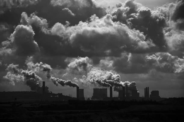 istock Lignite-fired power plants behind a brown coal mine with dramatic clouds and emissions 886676944