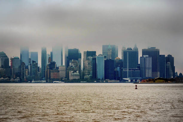 istock Manhattan from the water on the cloudy day 886684740