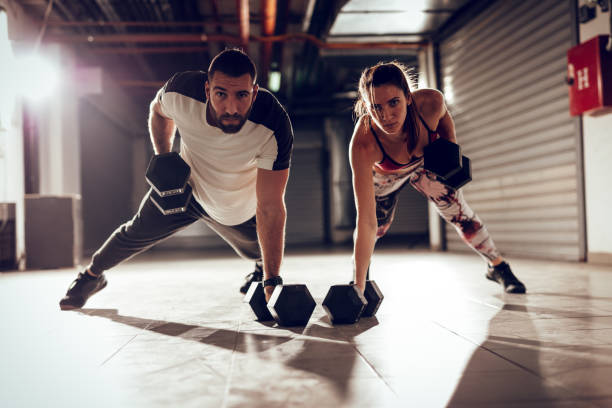 istock Couple At The Cross Training 886689622